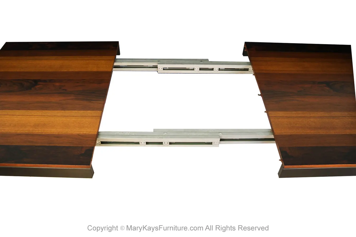 7d5c66ec-7f59-4d7e-ac3b-d83b26f41cfc_Mid-Century-Expandable-Milo-Baughman-Dining-Table-for-Directional-9.webp