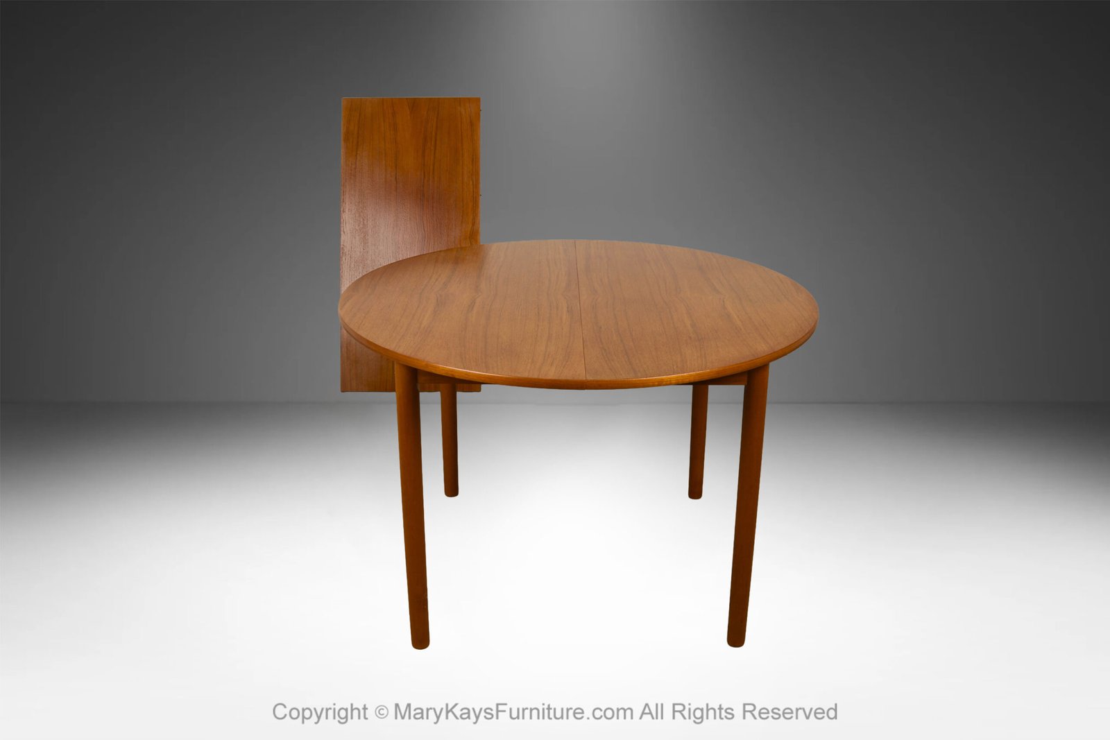 Mid-Century-teak-Round-Oval-Extendable-Dining-Table-5.jpg